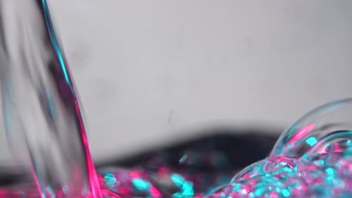 Neon Water Stream Splash with Bubbles
