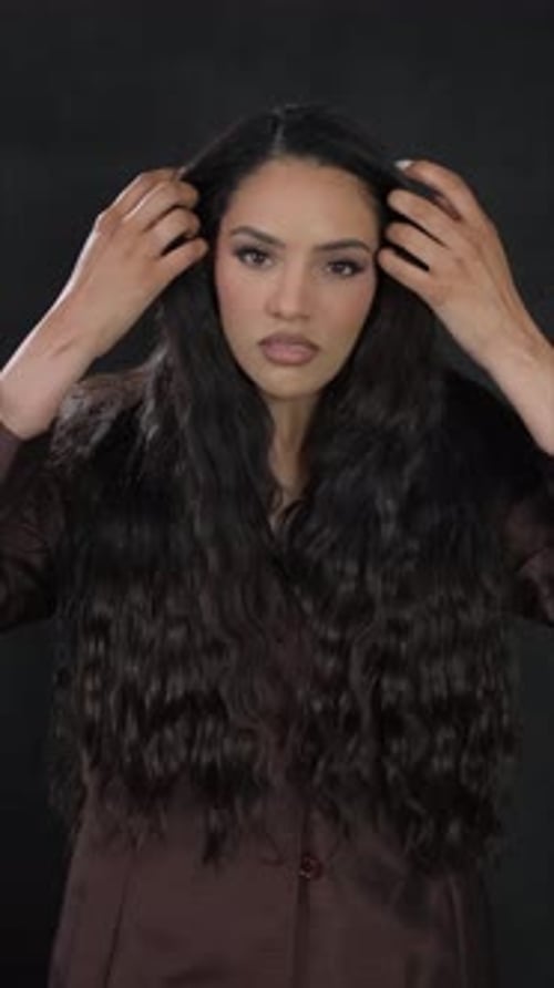Woman Posing with Beautiful Wavy Brunette Hair