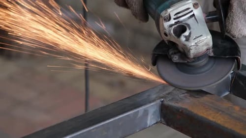 Grinding Metal with Flying Sparks Close Up
