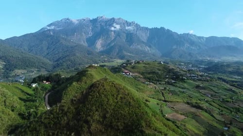 Beautiful Drone shot of the fields of Kundasnag showing Mount Kinabalu in the background Sabah Malay