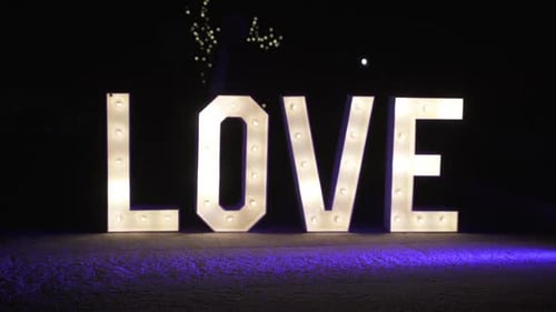 Yellow Light Up Love Sign Wedding Letters - Wide static shot