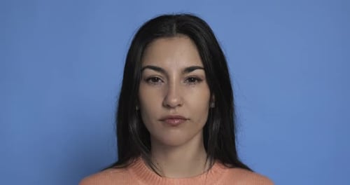 Attractive Woman Opens Eyes and Smiles
