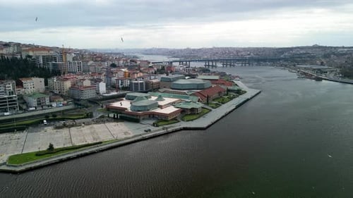 Halic Congress Center and Golden Horn Bridge fly back shot