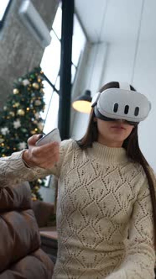 Woman Immersed in Virtual Reality Experience at Home