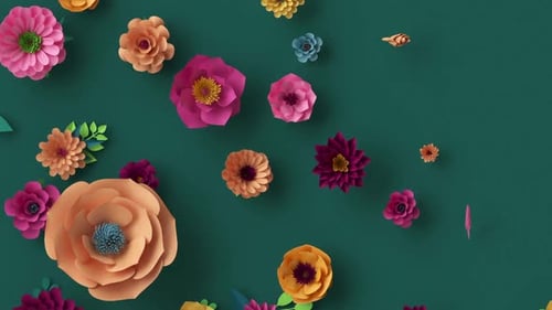 Paper flowers growing on a dark green wall