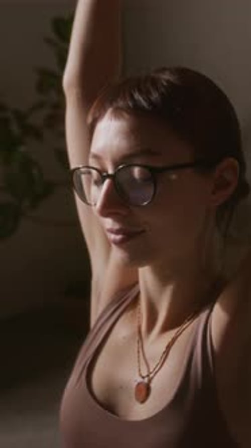 Woman in Brown Tank Top Yoga Stretching Indoor Portrait