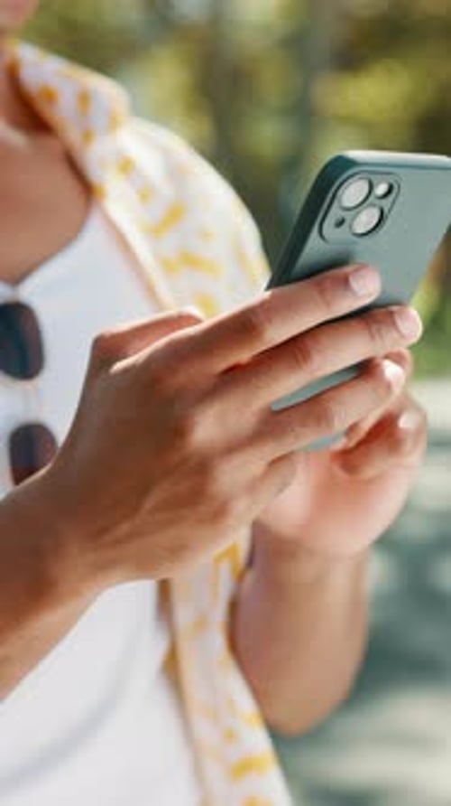 Hands, man and browsing with phone at park for social media post, internet news or text message