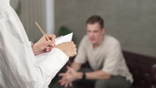 Man Talking to Therapist in Modern Home Environment