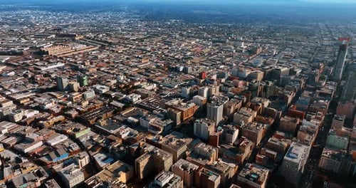 Urban densely built panorama of a modern metropolis. Flight above Los Angeles, California, the USA.