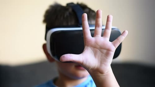 Child Experiencing Virtual Reality Headset Indoors