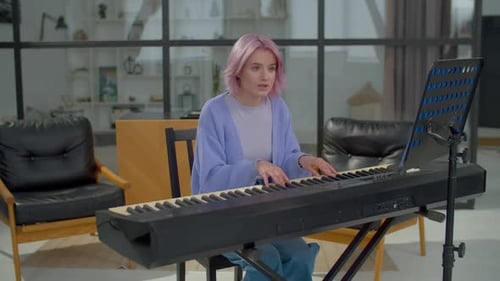 Woman Plays Piano and Sings in Living Room