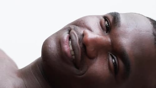 Close-Up of Smiling Adult with Wavy Hair