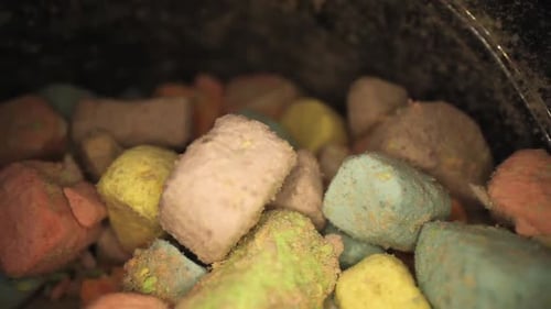 Slowly pulling past multi colored marshmallow pieces. using wide angle macro probe lens slowly passi