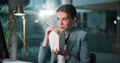Woman, fast food and eating in office at night for work, overtime and project deadline