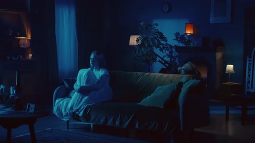 Blonde Woman on Couch with Gunman Approaching