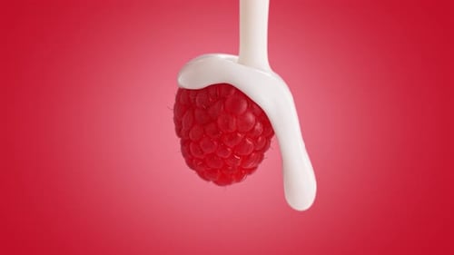 Yogurt Pouring from Top over a Raspberry on Pink Background in Slow Motion and Macro