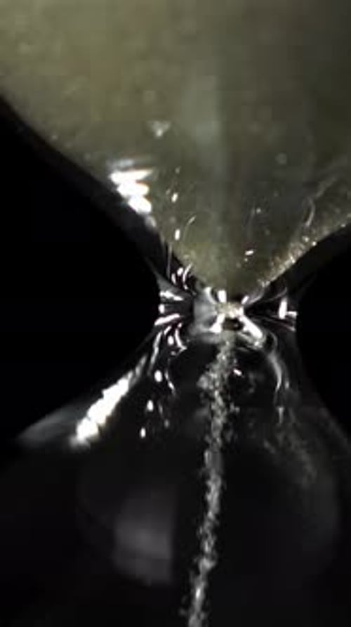 Super Slow Motion Sand Fall in the Hourglass Filmed on a Highspeed Camera at 1000 Fps