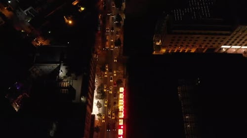 Athens city road by night aerial drone shot with many taxi