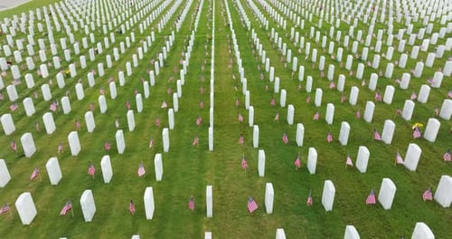 Aerial View of Large Sarasota National Cemetery with Rows of White Tomb Stones on Green Grass