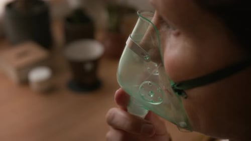 Senior Woman Using Breathing Mask, Treating Respiratory Disease at Home