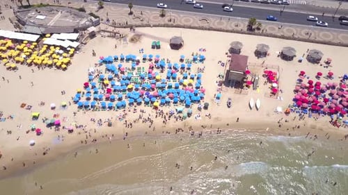 Mediterranean beach during summer with people in the water