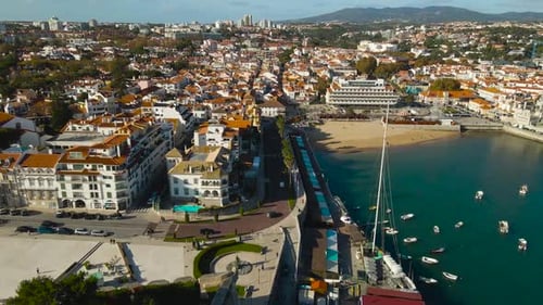 Beautiful Aerial View of Coastal Town Architecture and Sunny Beach Front