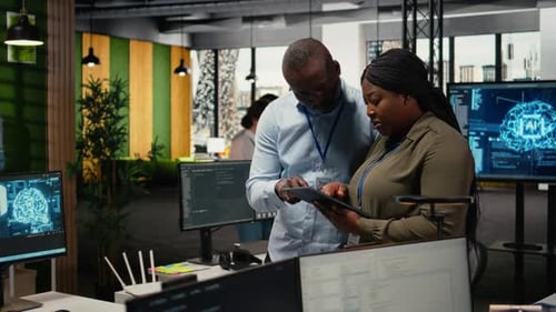 Team of Software Developers in Office Automating Workflows Using AI