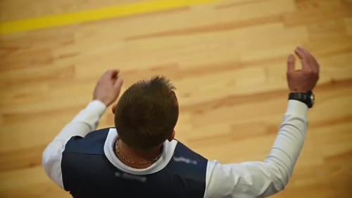 The referee makes a gesture of a break in the competition. Competitions in game sports