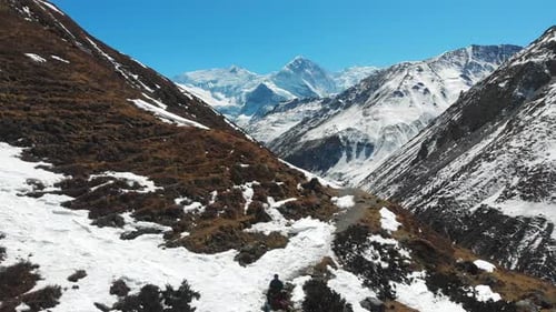 Aerial zoom out shot of Mount Annapurna three and Ganapurna Himalayas Mountain from Manang Valley, N
