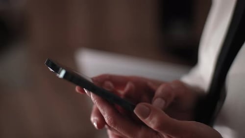 Hands Using Smartphone in Close Up