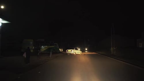 POV night drive through an African city