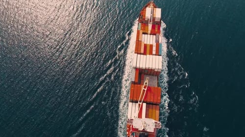 Cargo Ship Sailing Across the Ocean, Aerial View