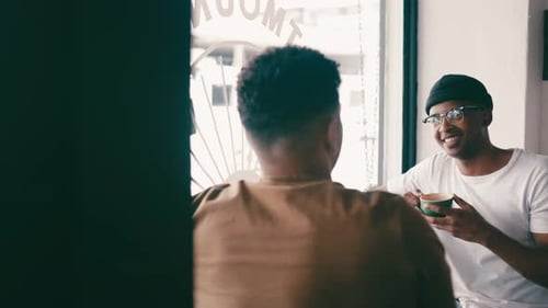 Relax, window and men talking in coffee shop for bonding, discussion and chatting together