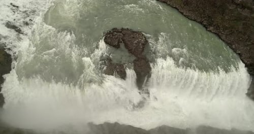 Aerial view of raging river and waterfalls in Iceland