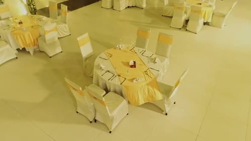 A stunning view captures wedding venue the ceiling features a lovely chandelier and flower decoratio