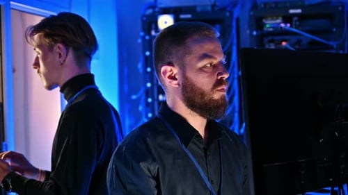 Men Working in a Futuristic Server Room