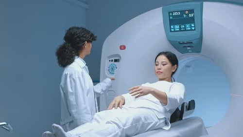 Woman Undergoes a CT Scan Exam in Hospital