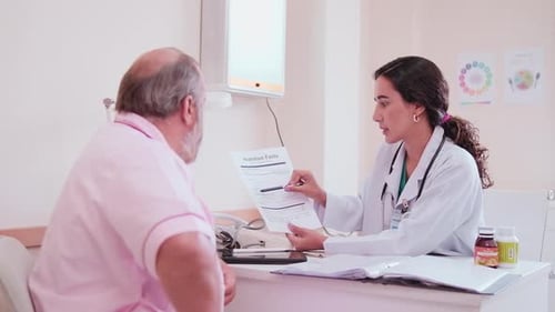 Doctor discusses nutrition facts with senior male patient
