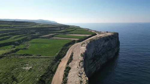 Aerial view of green fields and hills on the island. Selmun, green fields