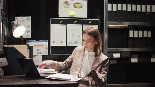 Young Adult Woman Working at Desk in Office