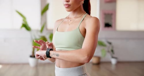 Hands, smart watch and woman in studio, exercise and wellness with fitness, calm and relax