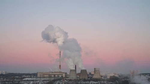 Thermal Power Station on Sunset with Thick White Smoke From the Pipes