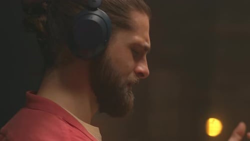 360 Degree Timelapse of Male Music Lover in Headphones Singing While Listening to Music at Home