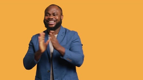 Man Happily Clapping Hands Applauding Studio Background
