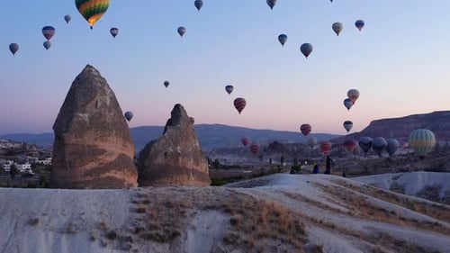 Hot Air Balloons Floating Over Cappadocia Landscape at Sunrise