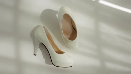 Bridal High Heels Poised in Sunlight, Ready for the Aisle Walk