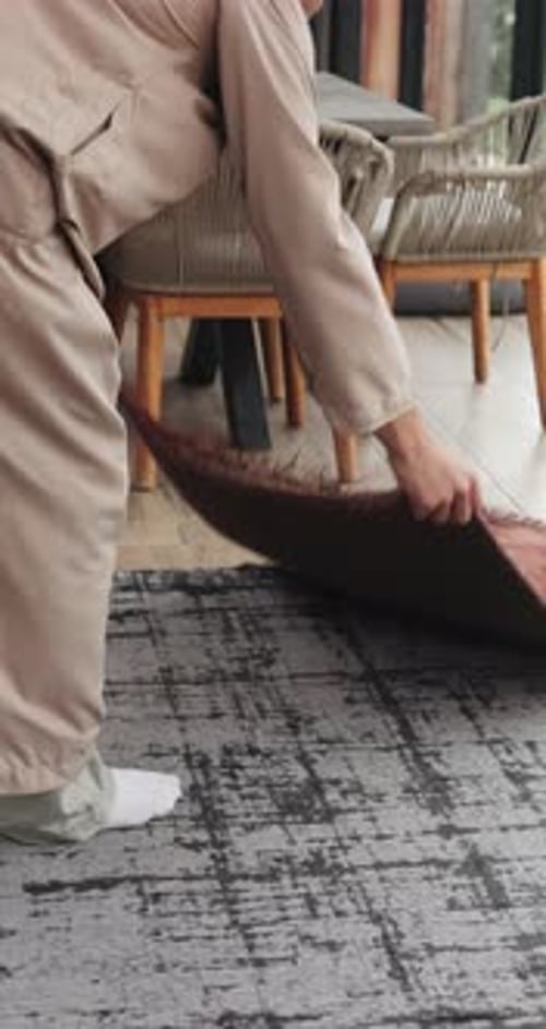 Prayer mat, home and Islamic man in lounge for ritual, religion and routine for guidance