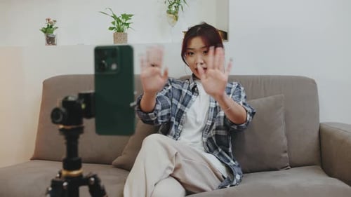 Woman Making a Video on Her Phone at Home