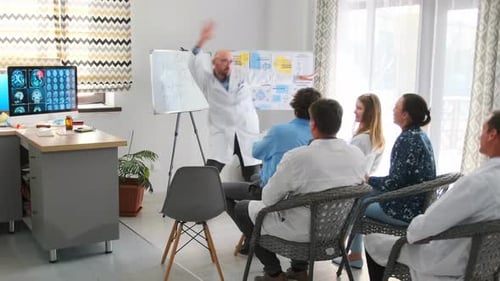 Doctor Giving Presentation to Colleagues in Modern Office