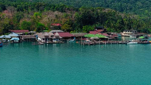Kayak Near a Picturesque Seaside Village in Calm Waters
